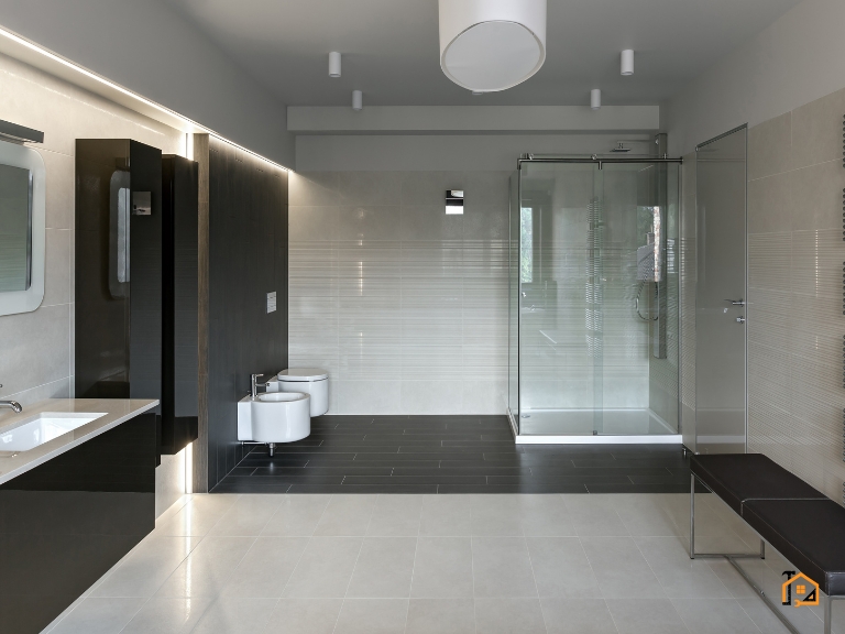 Nowoczesna łazienka z przeszkloną kabiną prysznicową i oświetleniem LED